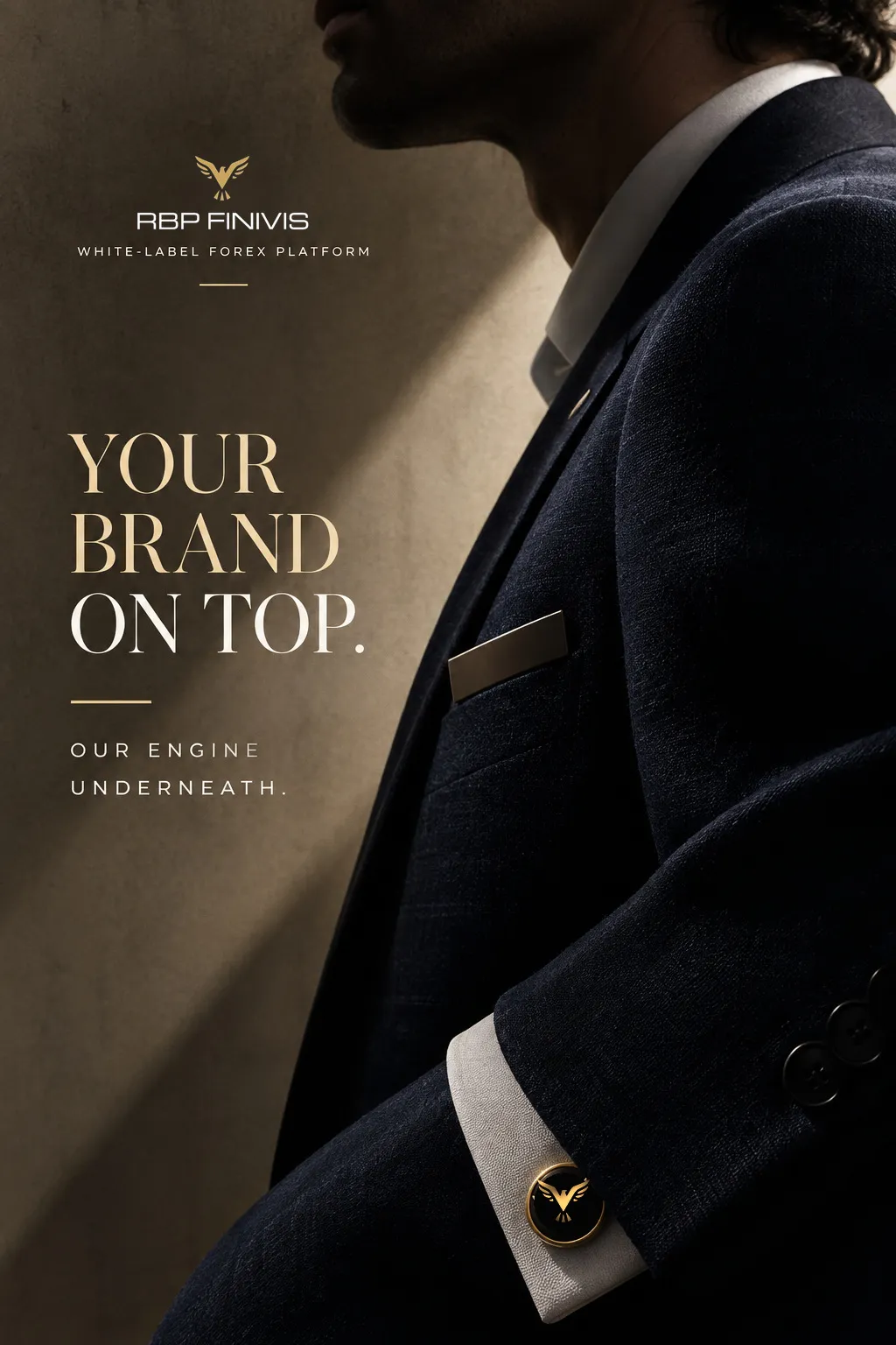 Side profile of a man in a dark tailored suit in warm side light; a gold eagle cufflink shows at the white shirt cuff. Headline: Your brand on top. Our engine underneath.
